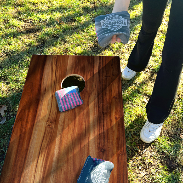 World Series of Cornhole Lightweight Cornhole Set - Acacia Woodgrain Boards with Red and Royal Blue Bags