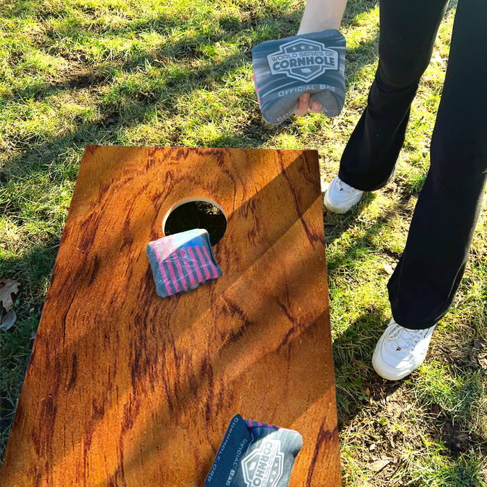 World Series of Cornhole Lightweight Cornhole Set - Tiger Woodgrain Boards with Red and Blue Bags
