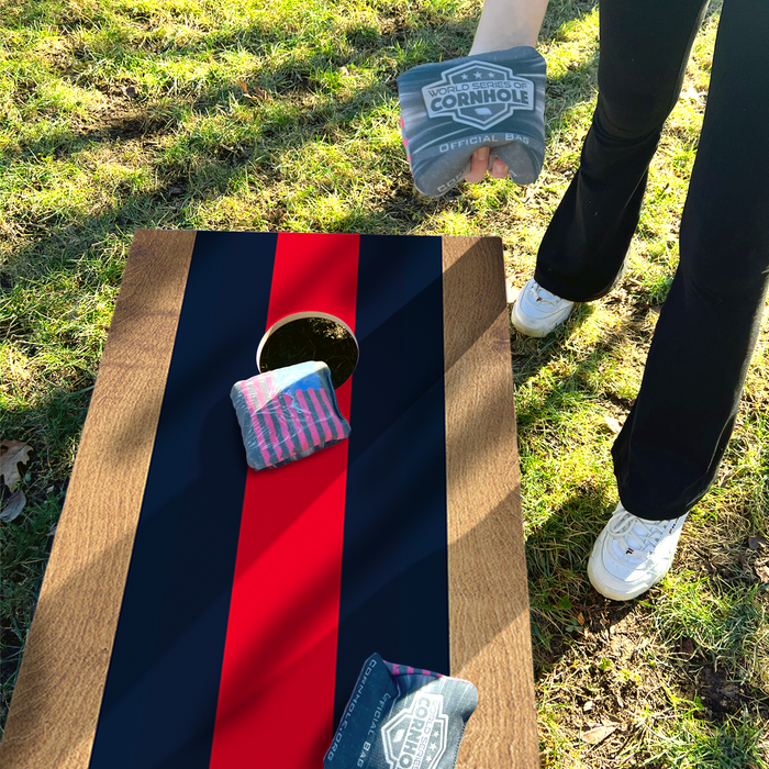 World Series of Cornhole Lightweight Cornhole Set - Blue and Red Stripes Boards with Navy and Red Bags