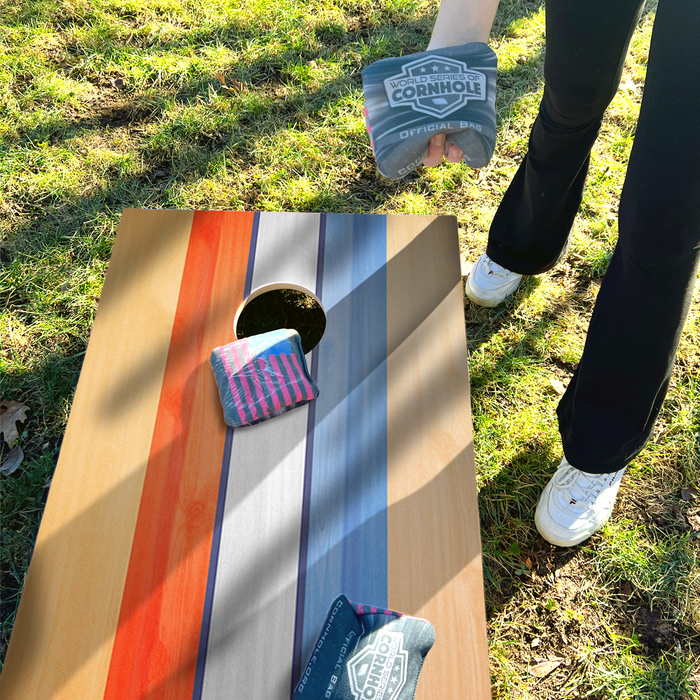 World Series of Cornhole Lightweight Cornhole Set - Retro USA Striped Boards with Orange and Baby Blue Bags
