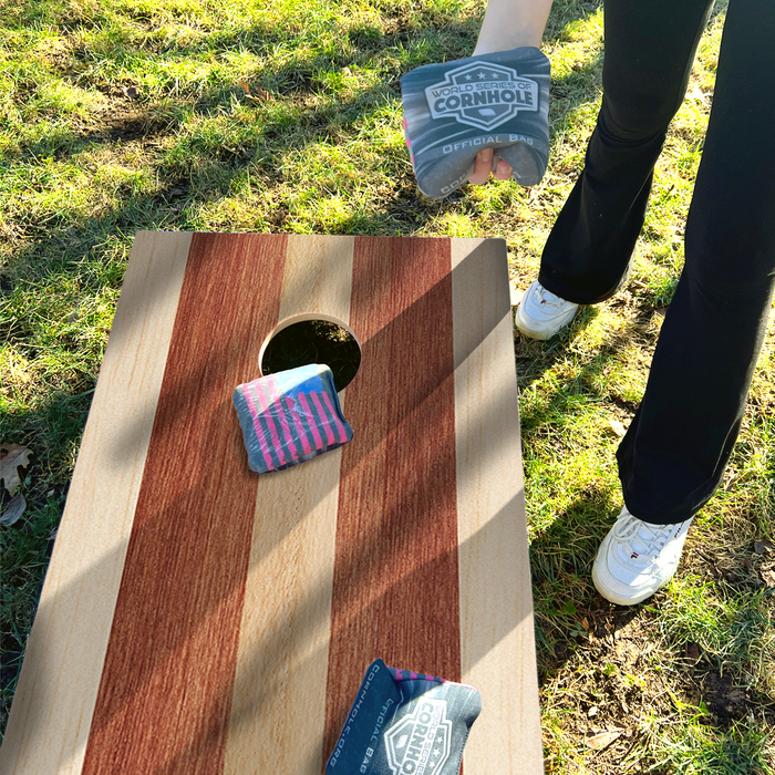 World Series of Cornhole Lightweight Cornhole Set - Alternating Light and Dark Wood Tones Boards with Red and Royal Blue Bags