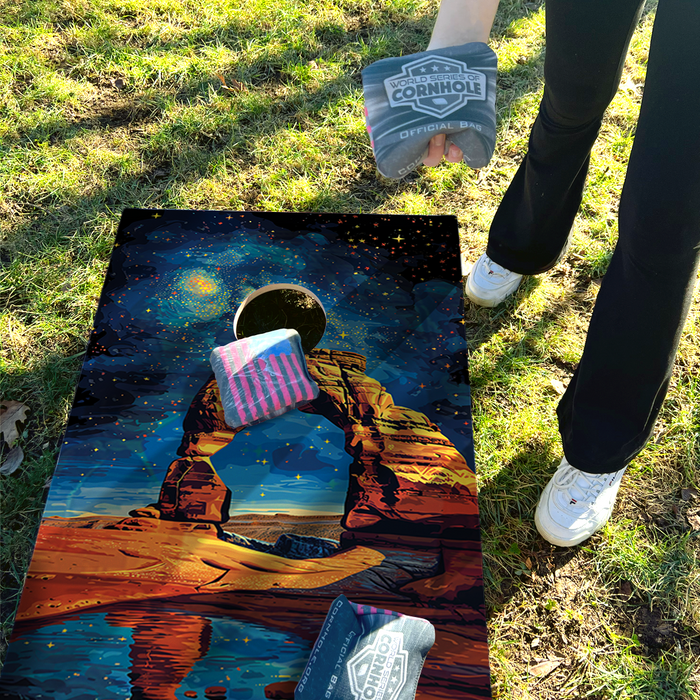 World Series of Cornhole Lightweight Cornhole Set - Arches National Park Nighttime Boards with Red and Royal Blue Bags