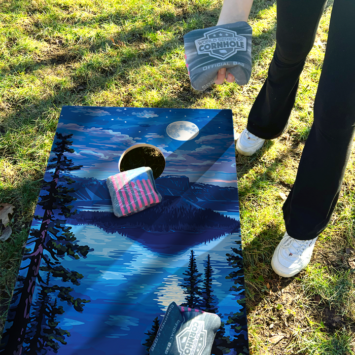 World Series of Cornhole Lightweight Cornhole Set - Crater Lake National Park Nighttime Boards with Red and Royal Blue Bags