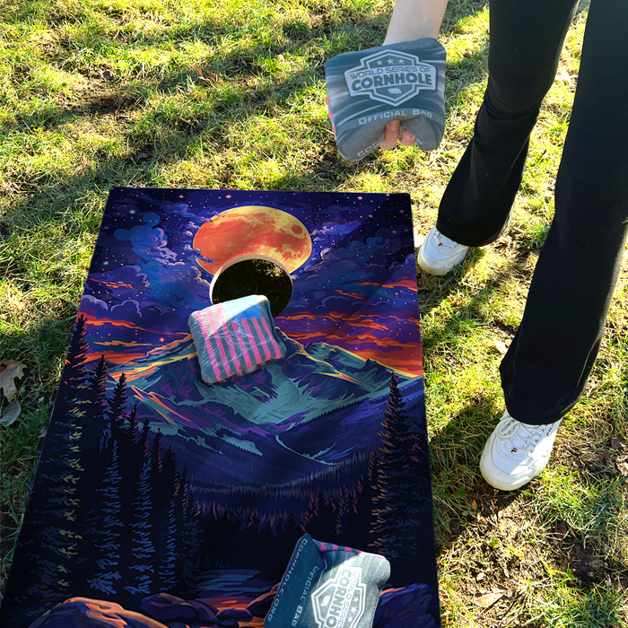 World Series of Cornhole Lightweight Cornhole Set - Rocky Mountain National Park Nighttime Boards with Red and Royal Blue Bags