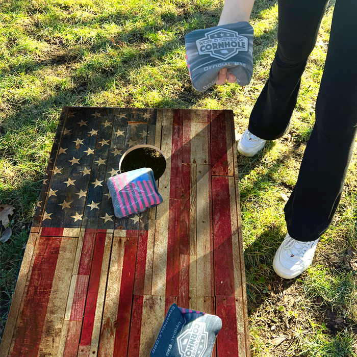 World Series of Cornhole Lightweight Cornhole Set - Rustic Left-Facing American Flag Boards with Red and Blue Bags