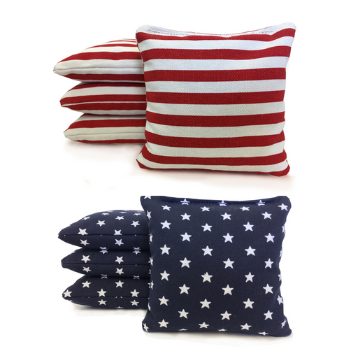 Corn-filled and resin-filled duck cloth cornhole bags in contrasting colors beside a regulation board
