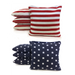 Corn-filled and resin-filled duck cloth cornhole bags in contrasting colors beside a regulation board
