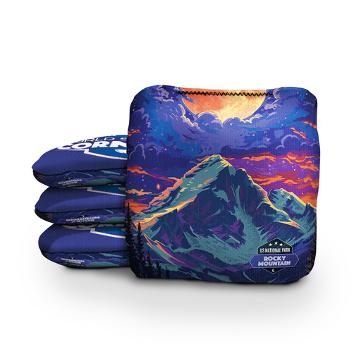 National park cornhole bags beside a regulation board with mountain, canyon and forest designs
