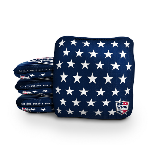Patriotic cornhole bags beside a regulation board with American flag and eagle designs
