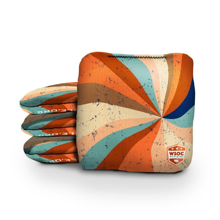 Retro and vintage-inspired cornhole bags beside a regulation board in a colorful game room
